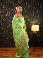 Load image into Gallery viewer, Model wearing Ichchhapuron's Nava, a green Benarasi saree with meena buti and zari highlight