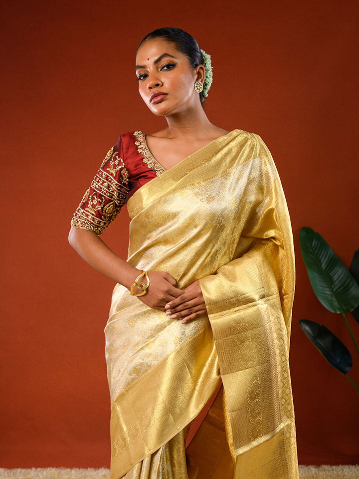 Model wearing Ichchhapuron's Sona saree, a tissue kanjeevaram with a broad golden border and traditional weave