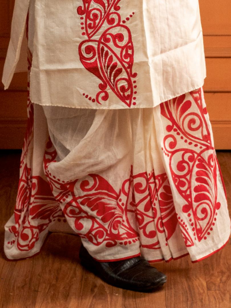 Red alpona on off-white Dhoti
