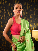 Load image into Gallery viewer, Woman wearing a pink blouse and green saree against a dark patterned wall | Plain deep neck blouse | Ichchhapuron
